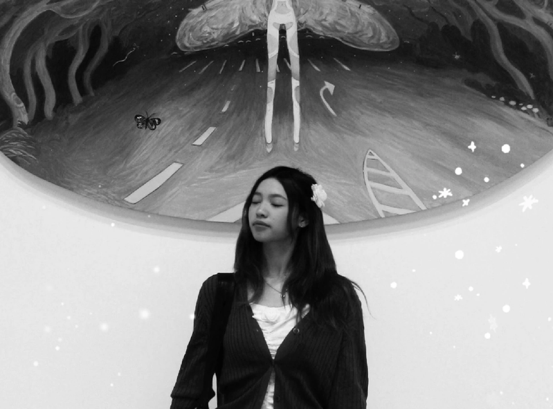 Erin in front of a mural